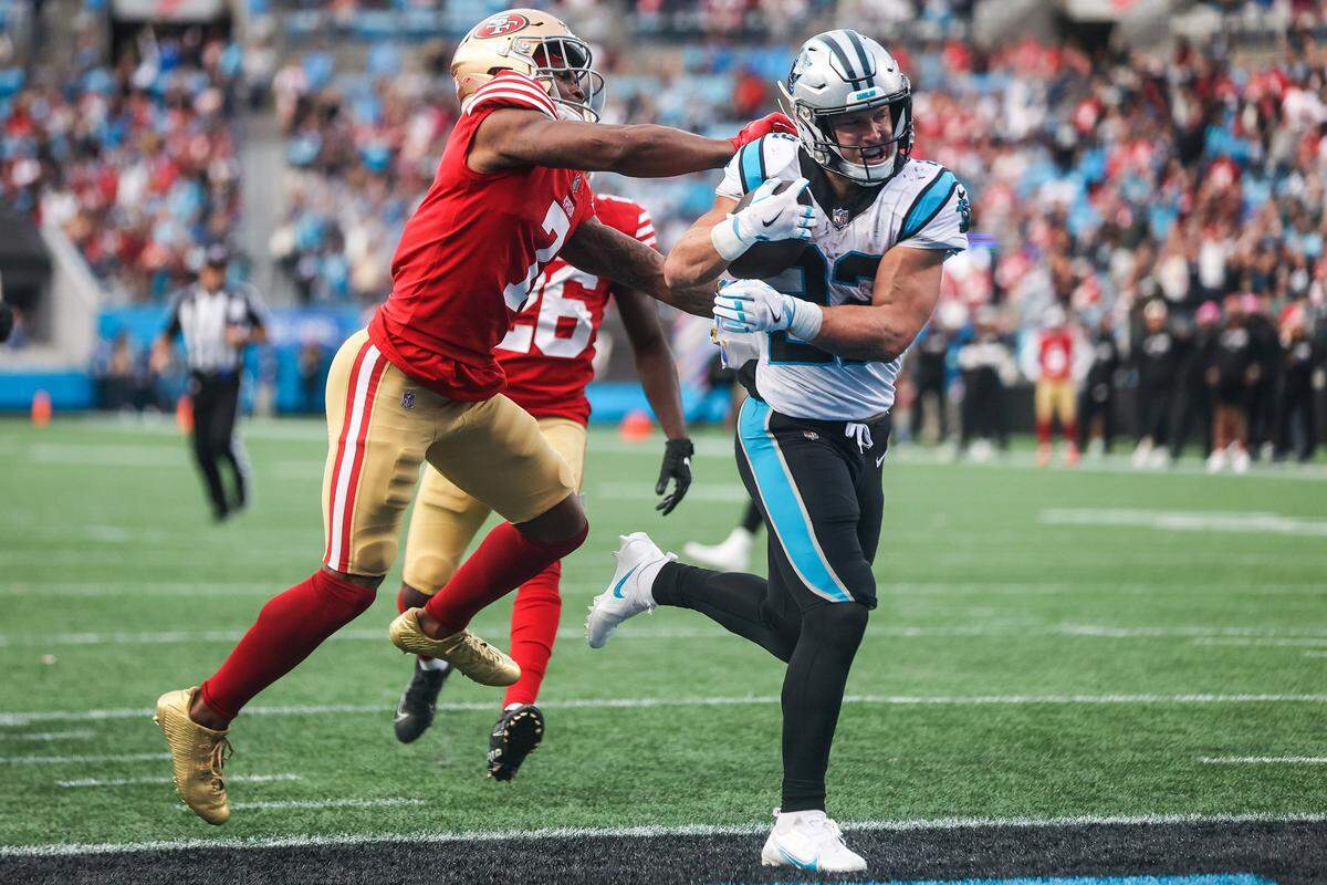 San Francisco 49ers cornerback Charvarius Ward shoves Panthers running back Christian McCaffrey as he runs into the end zone for a touchdown during their Oct. 9, 2022 game at Bank of America Stadium. Later that same month, McCaffrey got traded to San Francisco.
