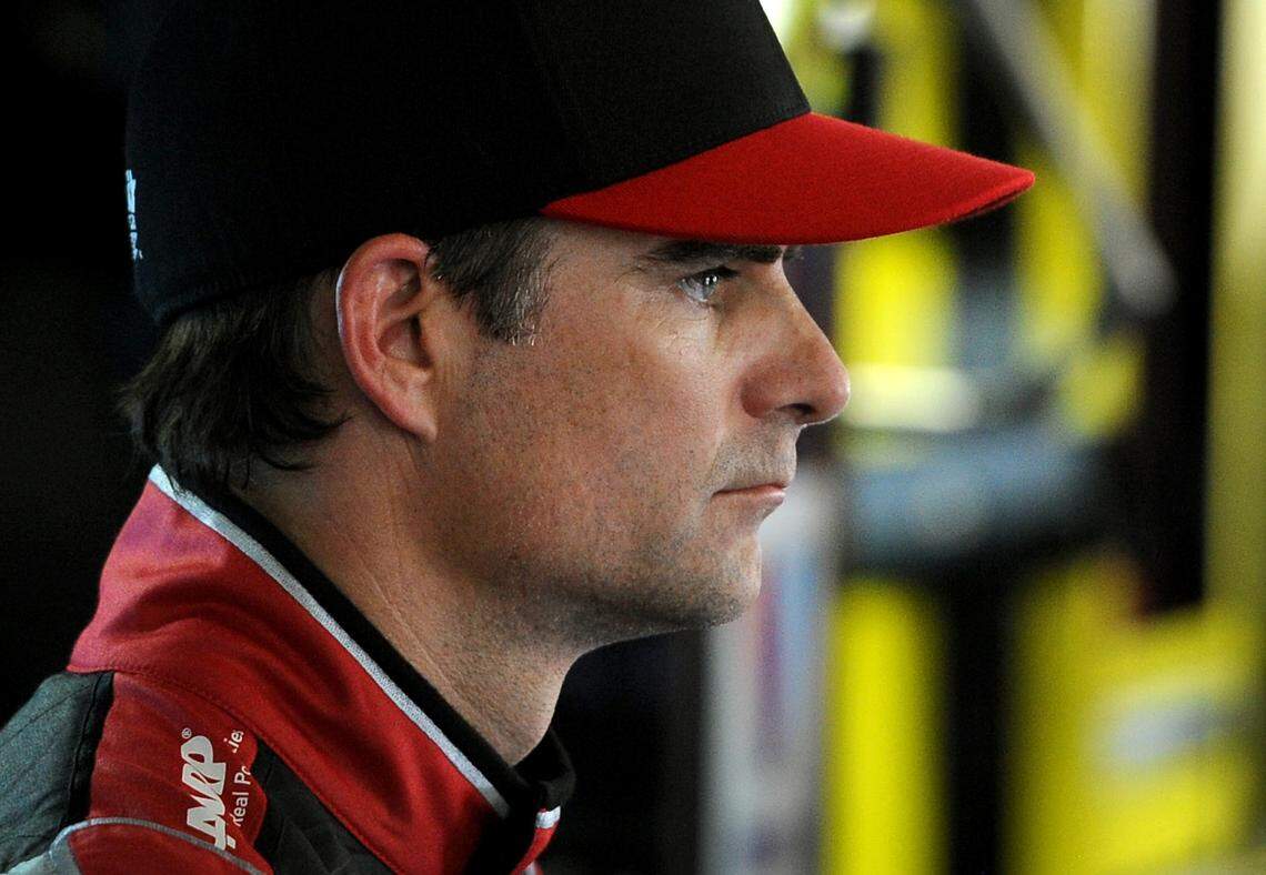 NASCAR Sprint Cup Series driver Jeff Gordon (24) watches as his team makes adjustments to the car following practice on Thursday, May 22, 2014 at Charlotte Motor Speedway in Concord, NC.