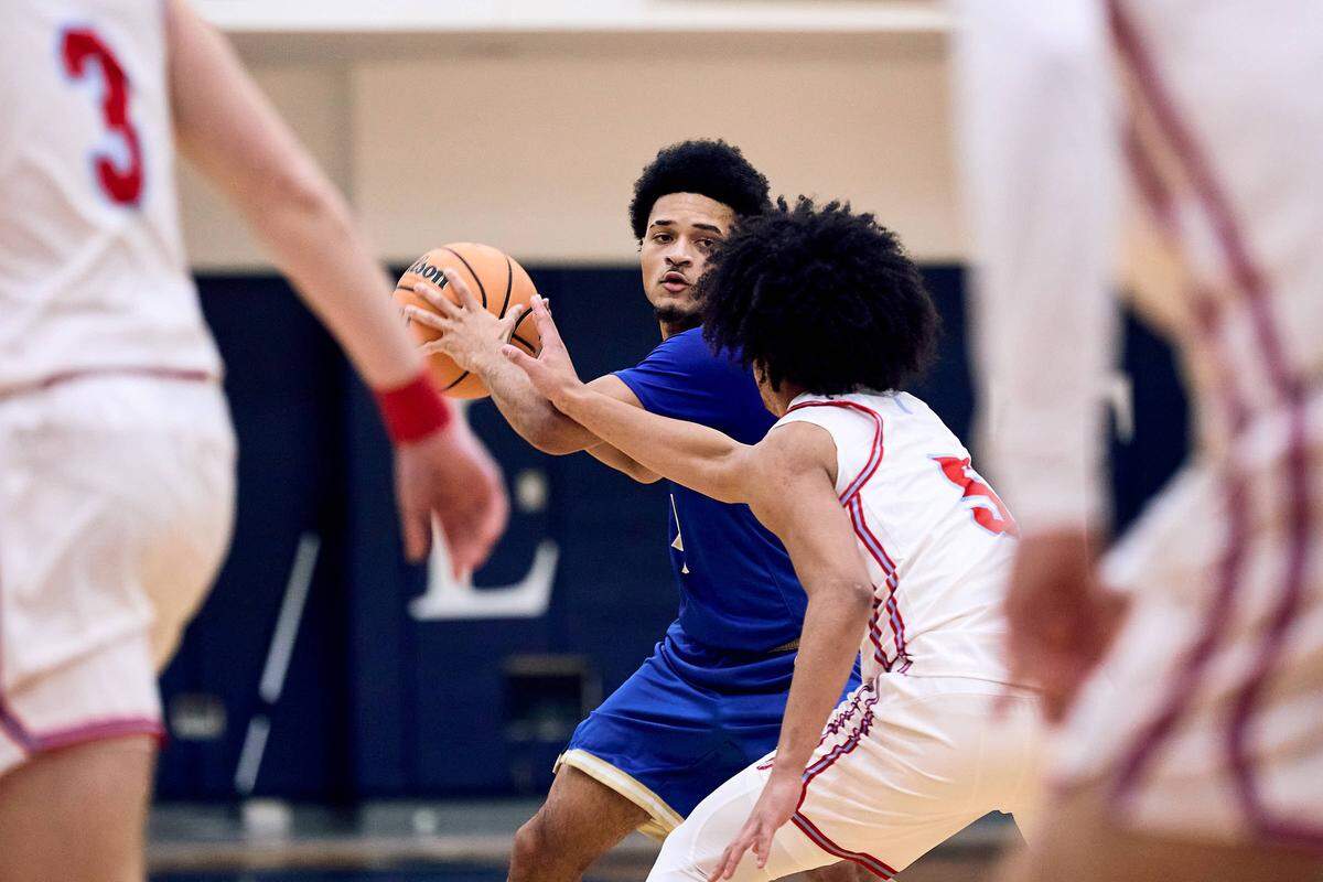 SouthLake Christian Academy guard Anderson Johnson (4) looks for an outlet pass in the first half of the 2025 Charlotte Latin Invitational Finals against Charlotte Catholic.