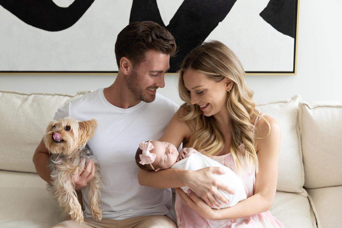 Jonathan Stevens and Rachel Rollar with their newborn daughter Summer Rae and Yorkshire terrier Mr. Caldwell.