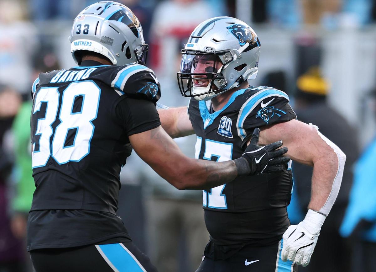 Carolina Panthers linebacker Josey Jewell, right, celebrates his sack of Arizona Cardinals quarterback Kyler Murray with teammate linebacker Amare Barno, left, during action at Bank of America Stadium in Charlotte, NC on Sunday, December 22, 2024. The Panthers defeated the Cardinals 36-30 in overtime.