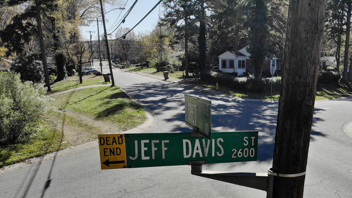 A car passes through the intersection of Moretz Avenue and Jefferson Davis Street in Charlotte on Wednesday, December 2, 2020. Jefferson Davis Street is one of the streets Charlotte’s Legacy Commission is recommending be renamed.