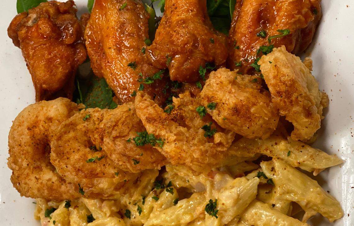 Wings, shrimp and lobster mac and cheese at Cuzzo’s Cuisine.