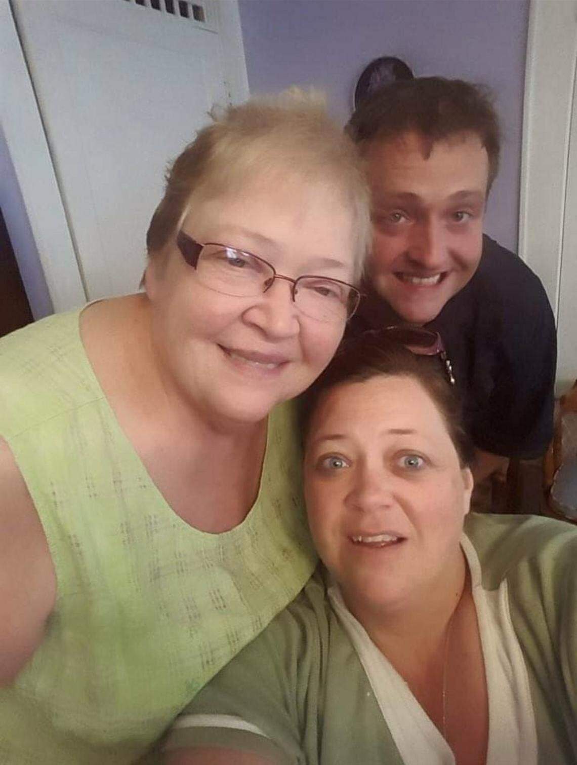 Ann Andrews with her two of her four children — son Stan Andrews and daughter Julie Davis, who died of COVID-19 on Sunday.