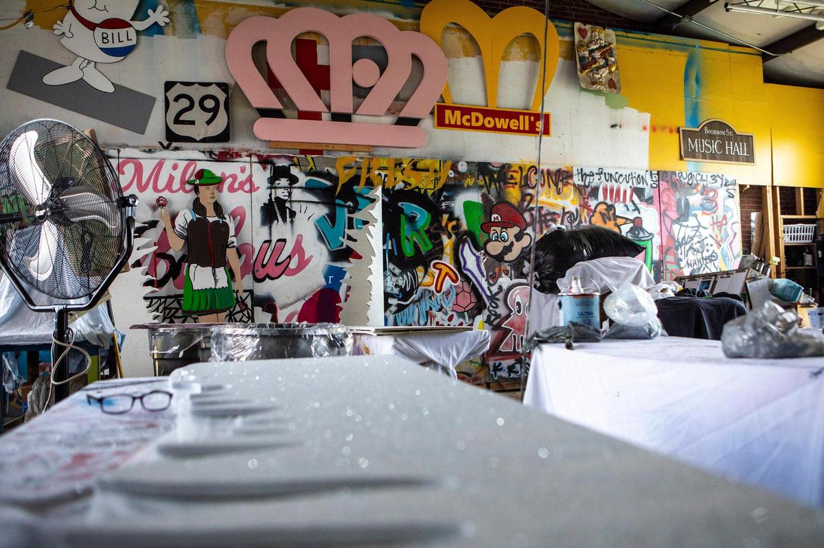 The in-house artist’s room at Extravaganza Events and Props has several old, new and in-progress pieces. The business has been a North Tryon Street staple for more than two decades but will likely be moving come the winter.