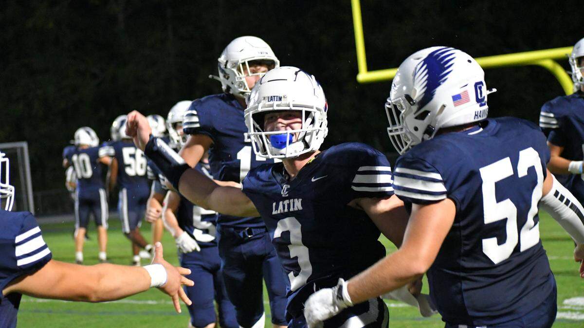 Charlotte Latin’s Gavin Provencher celebrates after a kickoff return for touchdown against Covenant Day.
