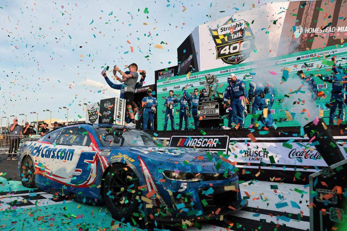 Mar 23, 2025; Homestead, Florida, USA; NASCAR Cup Series driver Kyle Larson (5) celebrates with his son after winning the Straight Talk Wireless 400 at Homestead-Miami Speedway.