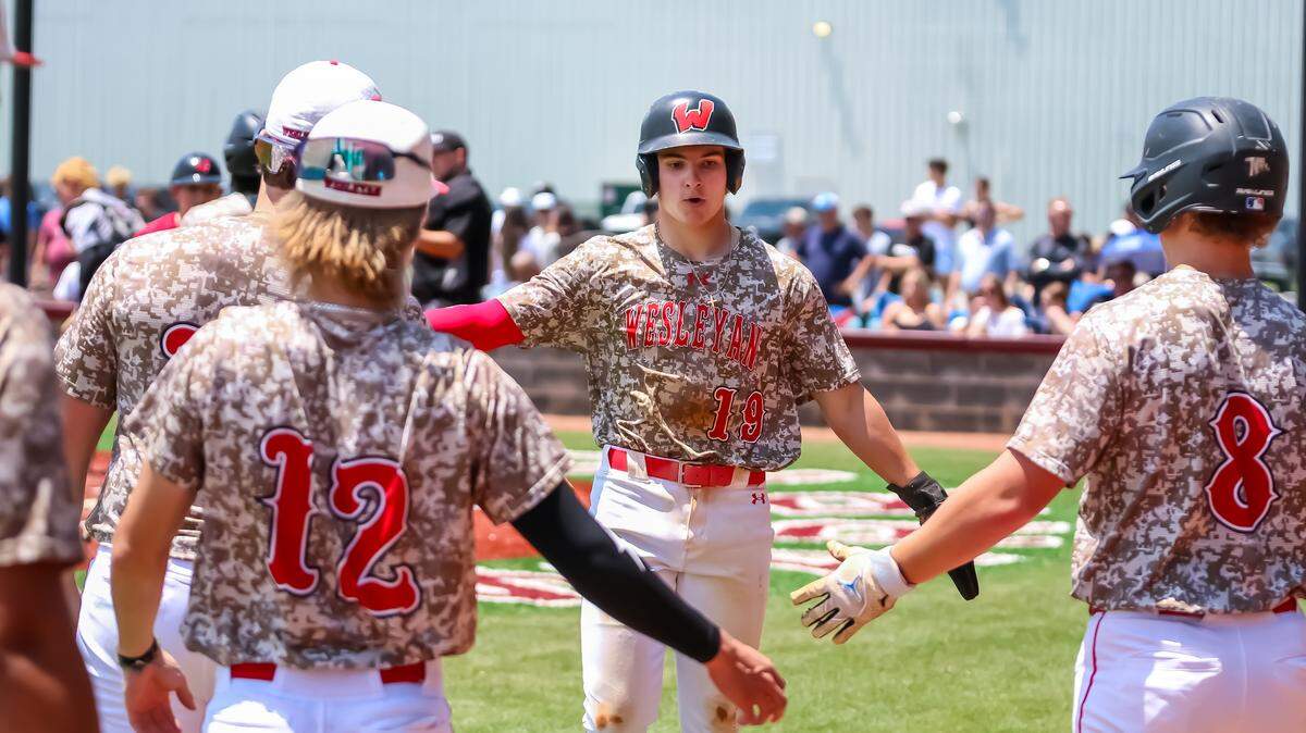 After crossing home plate for the first time Wesleyan Christian Academy Caleb Hasty sprints back to the dugout, greeted by a wave of high-fives at Metro Christian Academy in Indian Trail, North Carolina on May 17, 2025