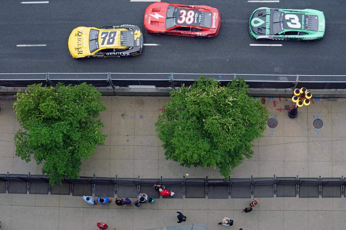 Jul 2, 2023; Chicago, Illinois, USA; NASCAR Cup Series driver Josh Bilicki (78) and driver Todd Gilliland (38) and driver Austin Dillon (3) race along Grant Park as fans walk along Michigan Avenue during the Grant Park 220 of the Chicago Street Race viewed from the eRacing Association turn 7 Skydeck at Venue Six10. Mandatory Credit: Jon Durr-USA TODAY Sports