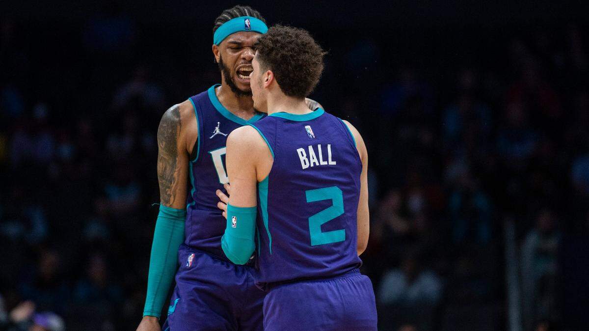 Hornets forward Miles Bridges yells in celebration at teammate LaMelo Ball after Ball hit a 3-point shot against the Pelicans at Spectrum Center on March 21. Bridges and Ball are averaging about 20 points per game.