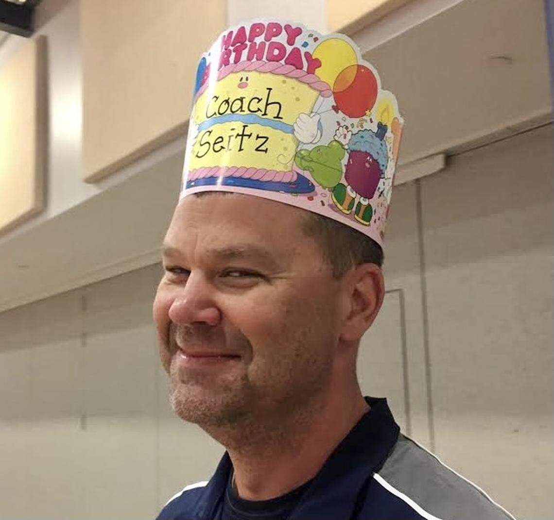 Lincoln Charter School PE teacher Jamie Seitz wears a birthday hat given to him by elementary schoolers. Seitz died at age 51 on Dec. 27, 2020, of COVID-19.