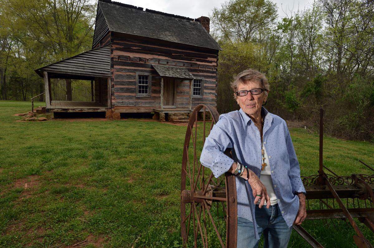 Philanthropist Anne Springs Close has died. In this file photo, Springs visited Billy Graham’s grandfather cabin.