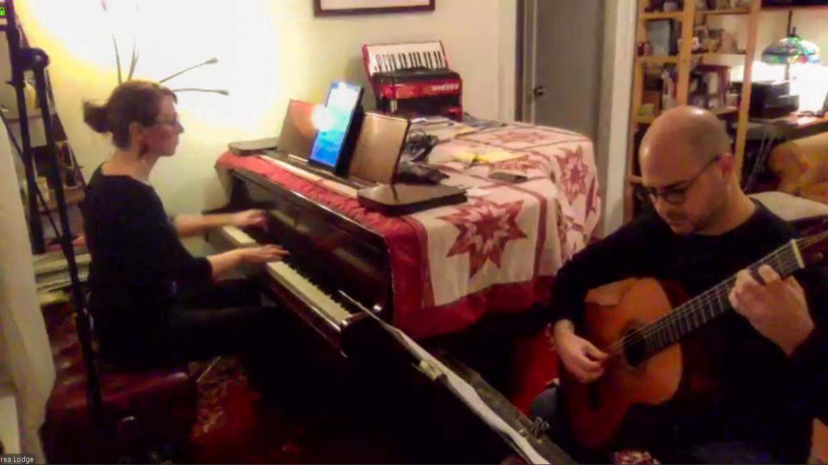 Charlotte New Music Festival is going virtual this June. As a lead up to it festival founder Elizabeth Kowalski has mounted a series of Tuesday night online concerts. Pictured here are Andrea Lodge and Jay Sorce of Sorce/Lodge Duo playing piano and guitar from their living room during the March 31 online concert.