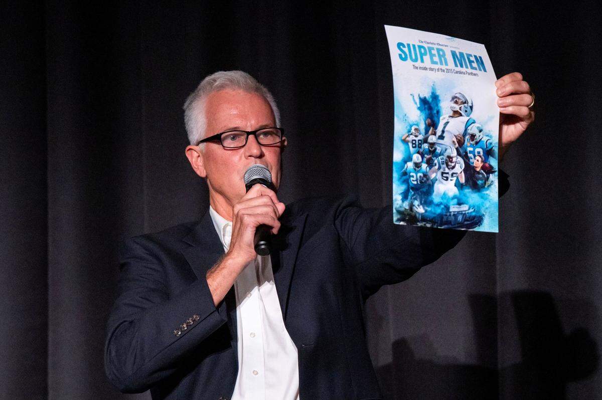 Charlotte Observer sports reporter Scott Fowler shows the movie poster of The Charlotte Observer’s movie ‘Supermen’ to the audience at the Independent Picture House in Charlotte, NC, Thursday July 24, 2025.