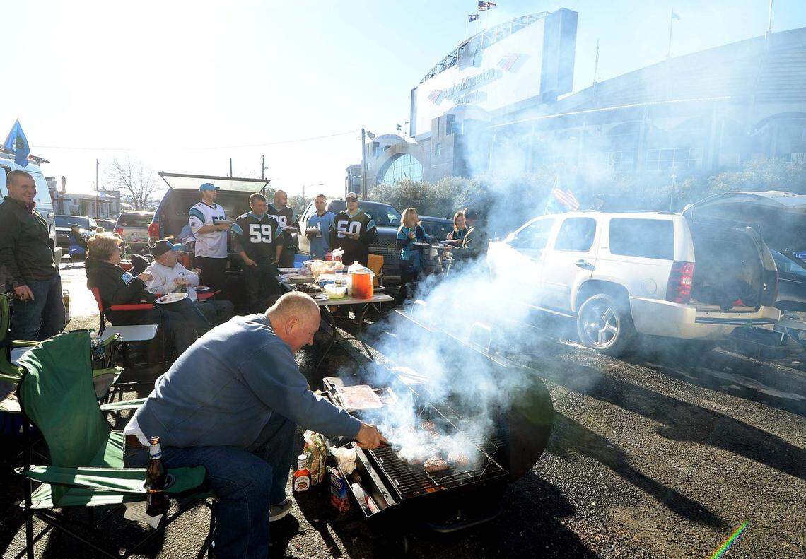 Panthers fans tailgate along College Street outside Bank of America Stadium during the 2015 season.