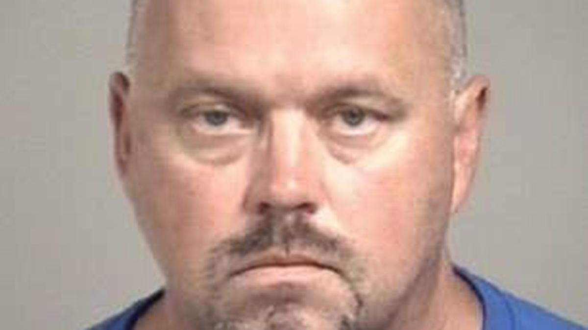 Robert Stanley Enloe, a 50-year-old former high school softball coach in Cabarrus County, North Carolina, was charged on Thursday in connection with sex crimes against a minor that sheriff's investigators said occurred in 1994.