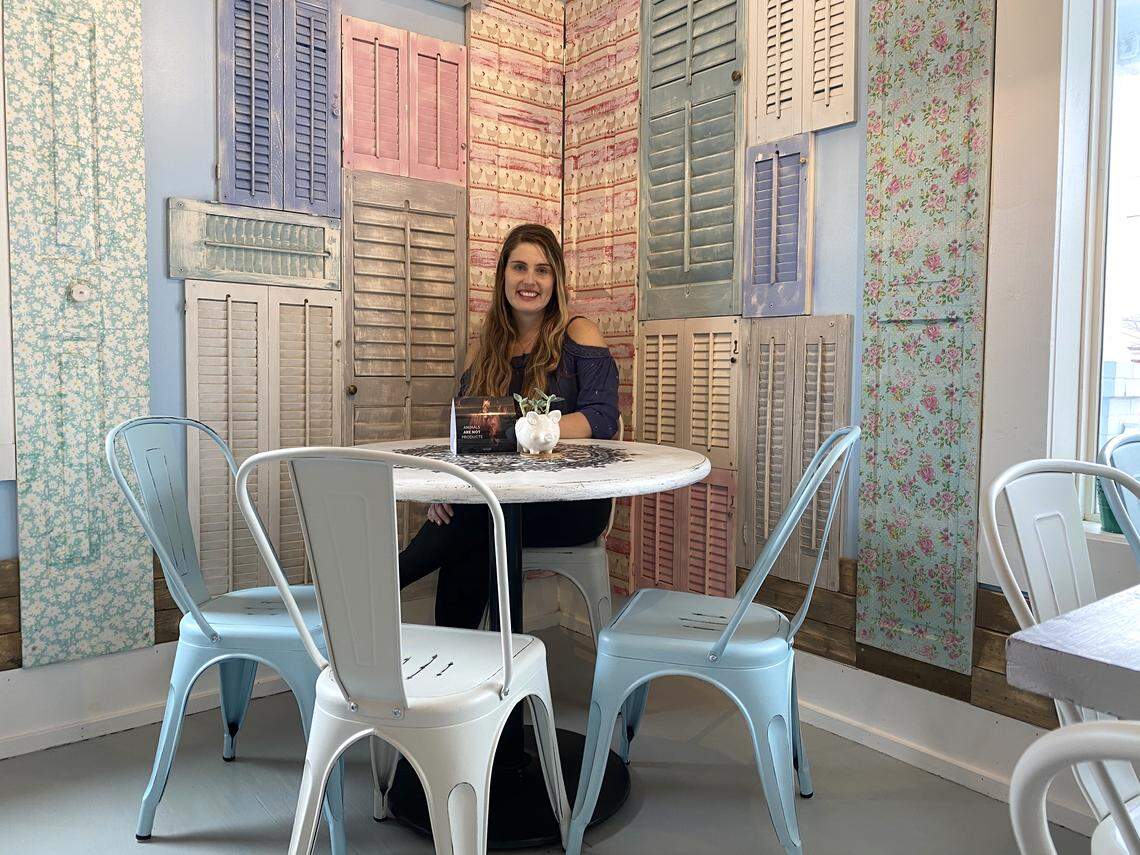 Oh My Soul vegan cafe co-owner Tallulah Duffin said the team used all repurposed materials when designing the interior of the vegan cafe. She is shown here among repurposed furniture and shutters.
