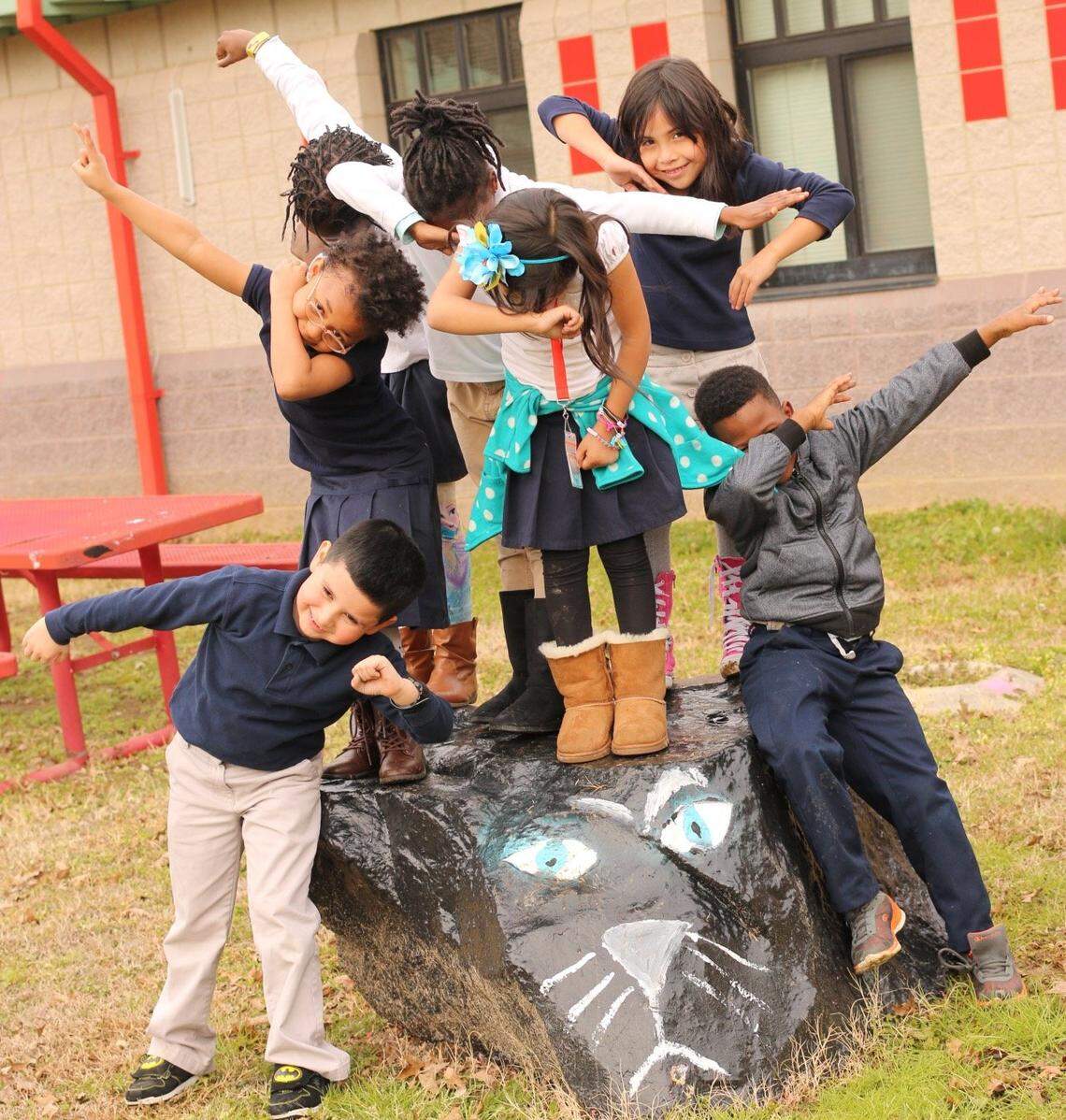 Students at Sedgefield Elementary School do the dab.