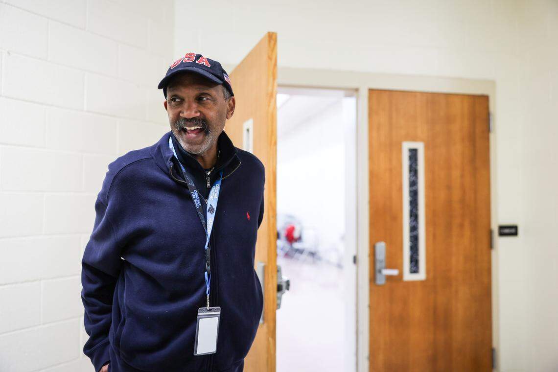 Precinct Judge Patrick Burris smiles as he waits for voters at Lake Wylie Elementary School during the primary election in Charlotte on Tuesday.