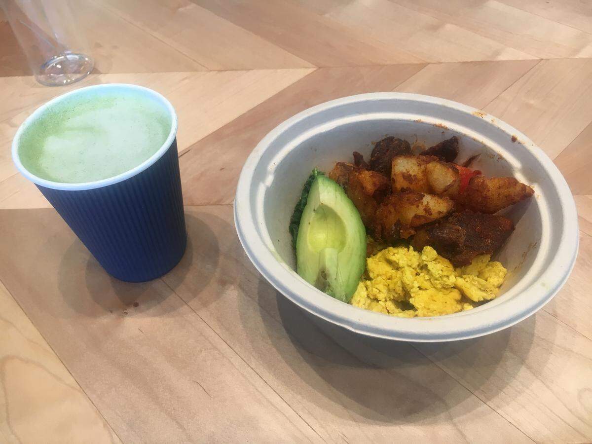 The Breakfast Bowl at Eight + Sand inclues an egg and potato wedges with avocado, kale, peppers, onions and parsley pesto.