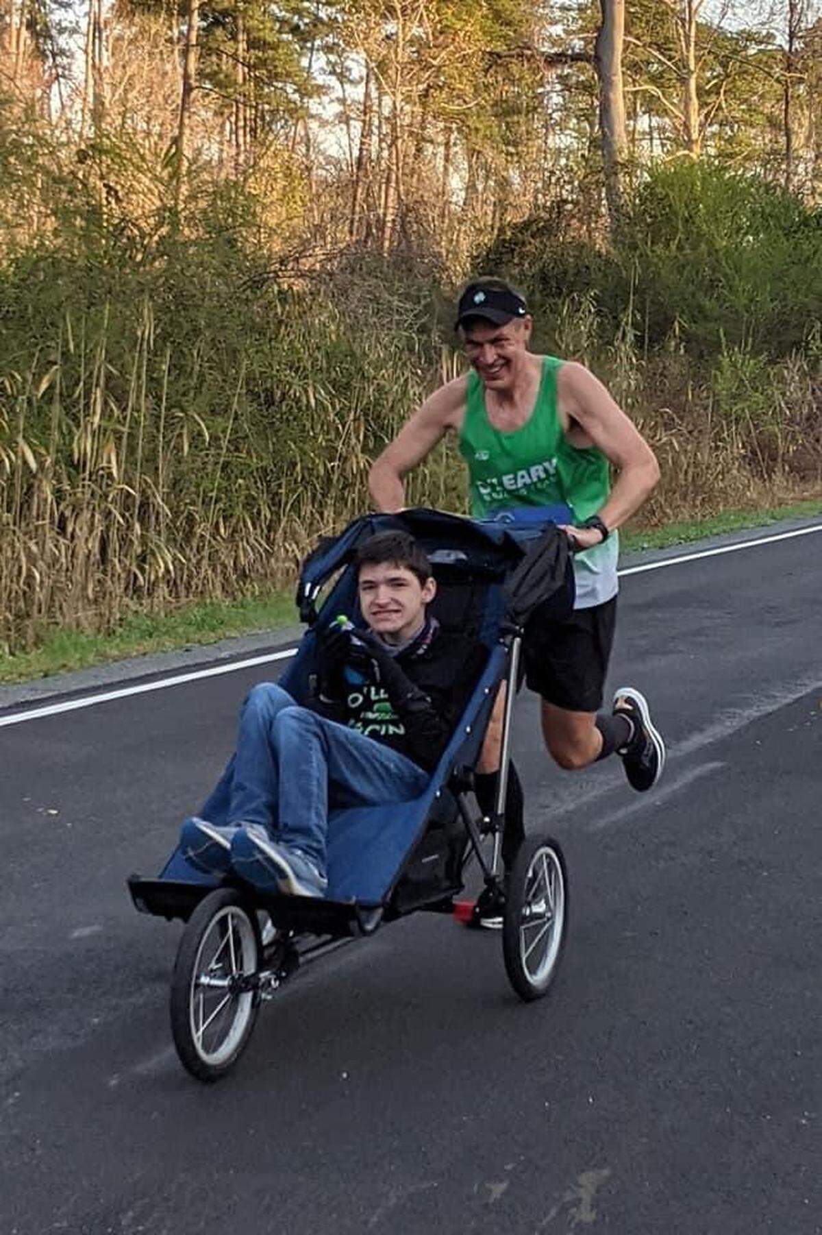 Bill pushes Logan through the Strider BQ Invitational Marathon in Chesapeake, Va., on March 27.