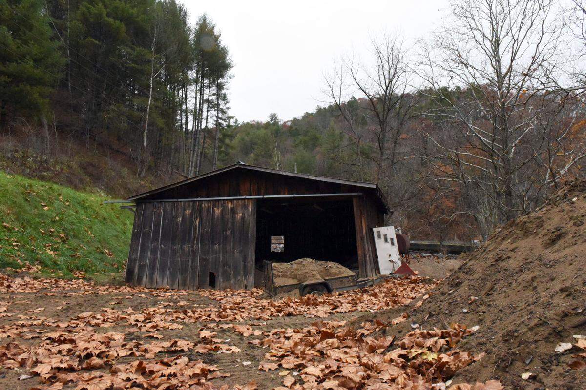 A building near Ashe County’s normal polling site for its Hurricane Precinct sits mangled and filled with sand after Tropical Storm Helene.
