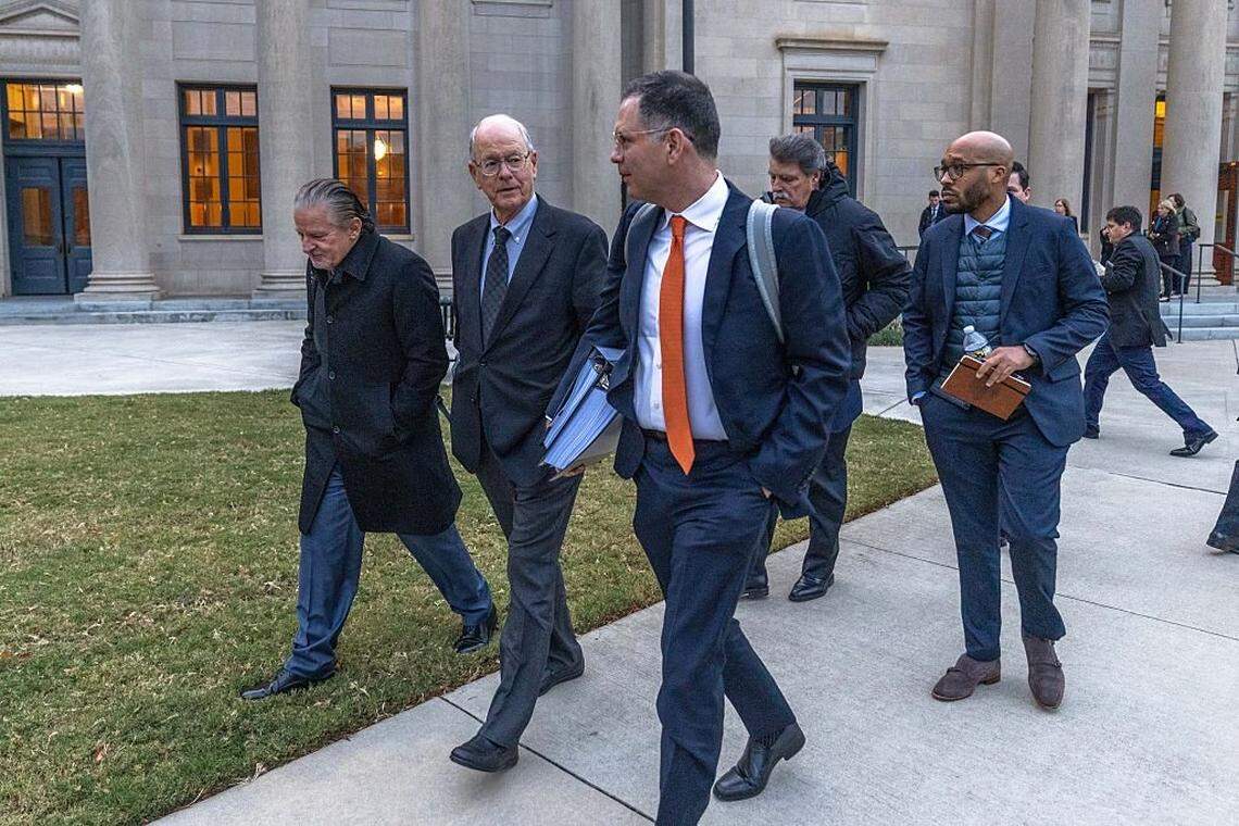 CHARLOTTE, NORTH CAROLINA - DECEMBER 1: Jim France (C), NASCAR chairman and CEO, departs the Charles R Jonas Federal Building on December 1, 2025 in Charlotte, North Carolina. Jury selection and an opening statement began an antitrust lawsuit filed by Michael Jordan's 23XI Racing team against NASCAR. (Photo by Grant Baldwin/Getty Images)