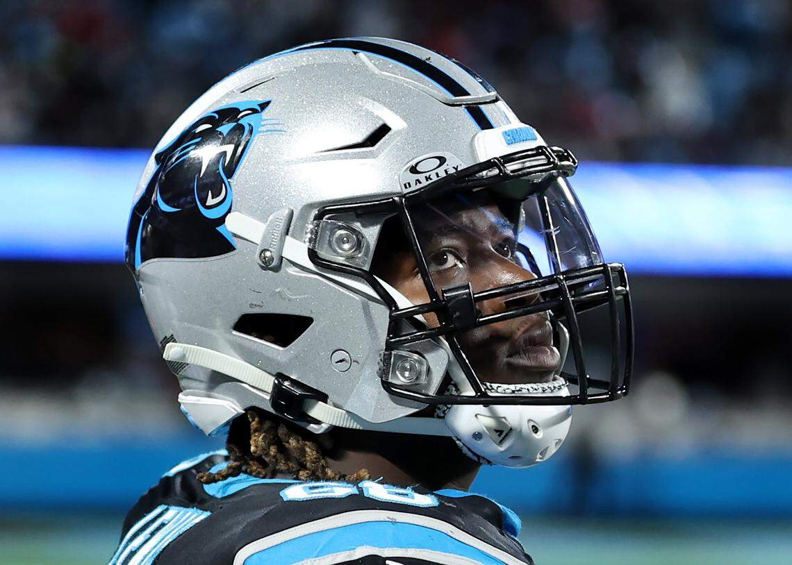 Carolina Panthers guard Damien Lewis stands along the team’s sideline during a 2024 game against the Tampa Bay Buccaneers at Bank of America Stadium.