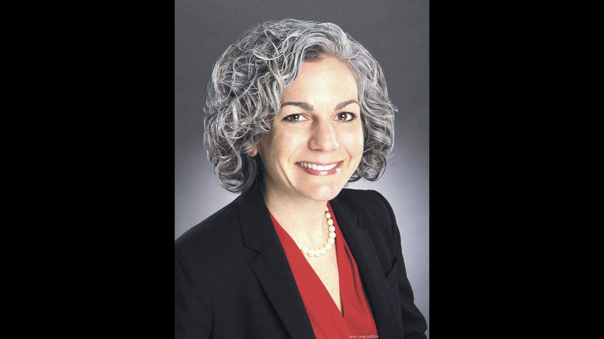 Laura Clark, president and CEO of United Way of Central Carolinas, announced a 25-percent funding cut over 18 months to its 73 member nonprofits. The United Way also will cut $1 million from its operating expenses, she said.