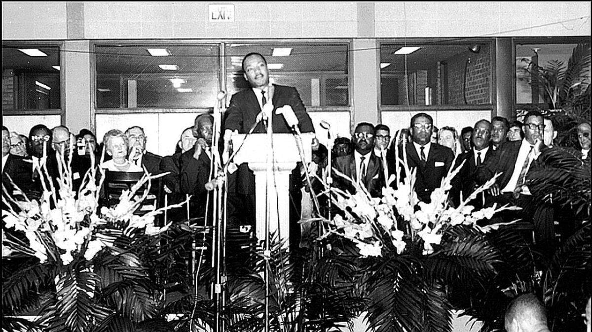 Curt Peters says he’ll always remember crouching at the feet of Dr. Martin Luther King Jr. on Sept. 21, 1966, as the civil rights leader spoke at Johnson C. Smith University. Peters (bottom center, crouching in front with back to the camera) was a senior at JCSU and editor of the school newspaper that year. His journalistic duties allowed him to get close to King, who spoke to a crowd of nearly 6,000. ”It left me with an impression that ... I had been in a special place in time,” Peters said. “Here was a man who went on to lead America to doing the right thing for all people. He sacrificed himself in order for the cause of total integration into the American system.”Cristina Bolling Photo courtesy of Curt Peters