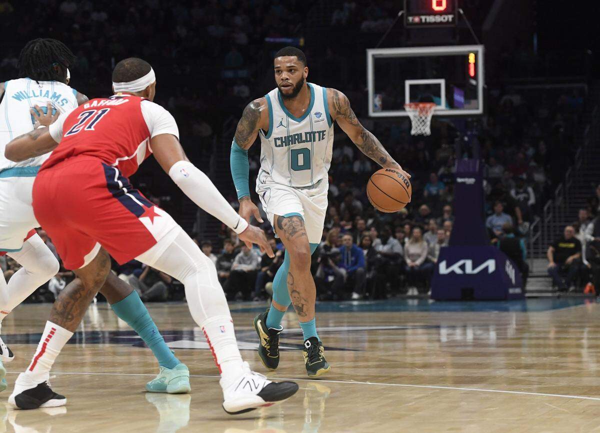Hornets forward Miles Bridges looks to drive during the first half against the Wizards on Friday night. / Sam Sharpe-USA Today Sports