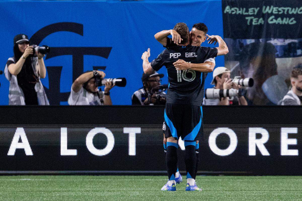 Charlotte FC midfielder Ashley Westwood celebrates with midfielder Pep Biel after a goal against the San Diego FC on Saturday night at Bank of America Stadium. Scott Kinser-Imagn Images