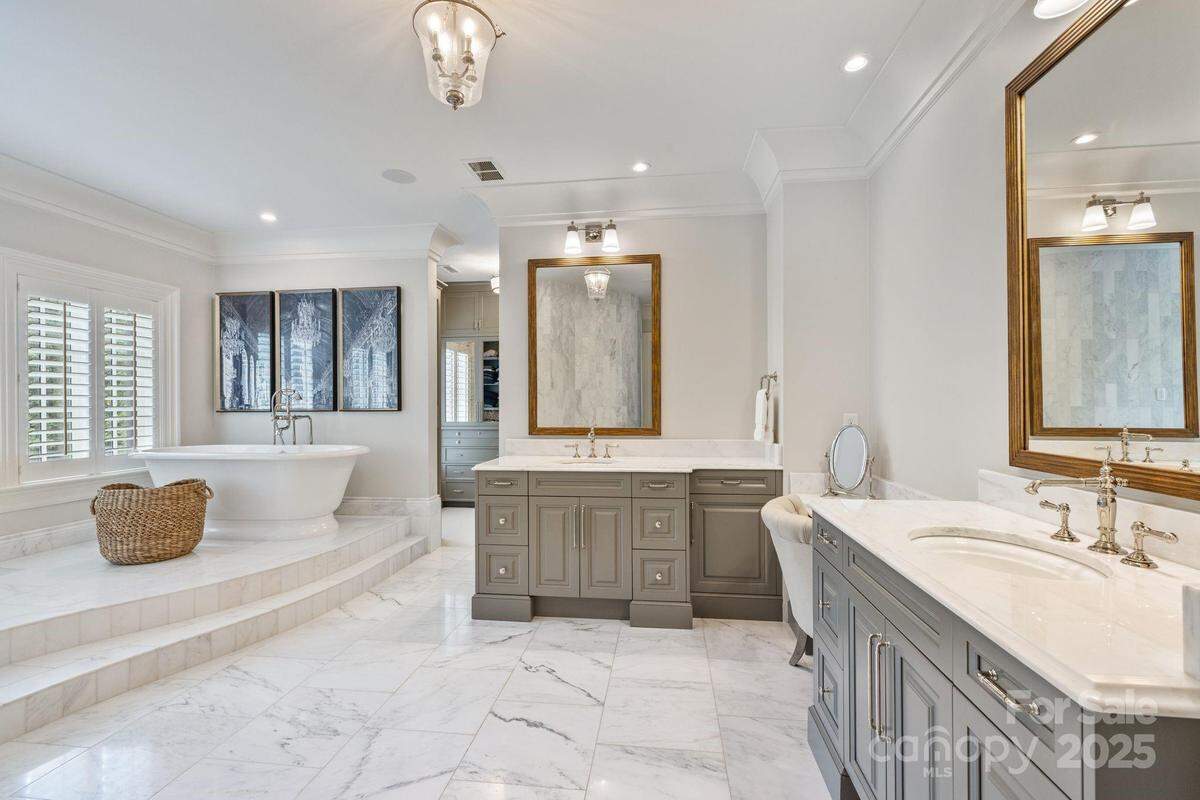 Shown is a spacious bathroom in ex-NASCAR driver Jamie McMurray’s Lake Norman mansion. 