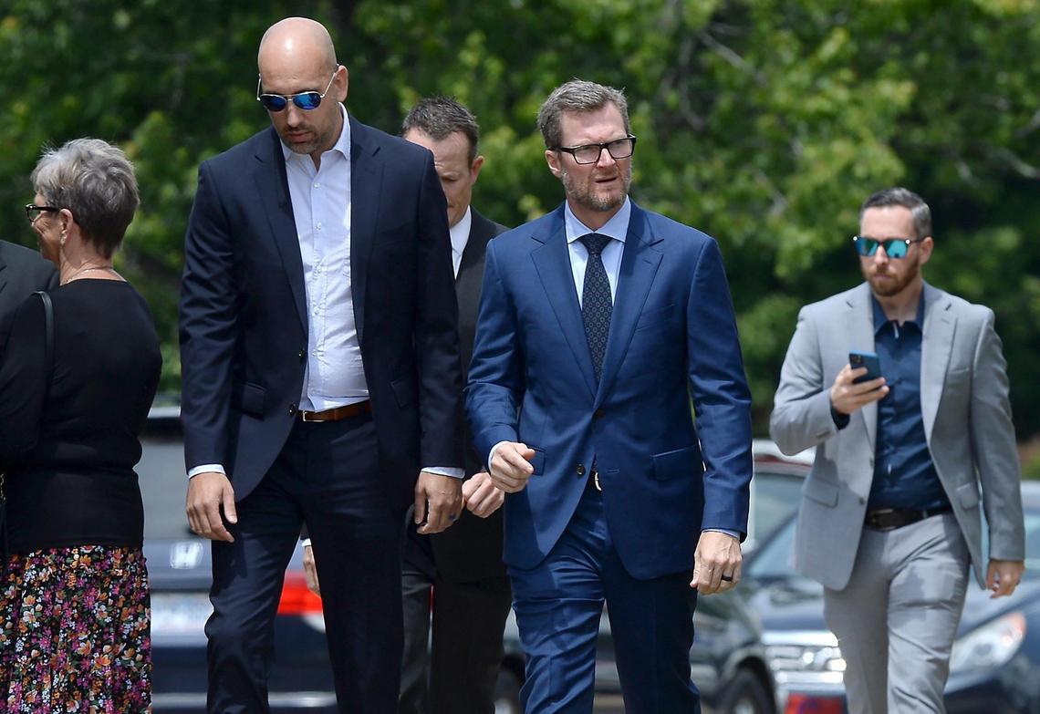 Former NASCAR driver Dale Earnhardt Jr., center, prepares to enter Central Church in Charlotte, NC on Thursday. Earnhardt Jr. was among those attending the funeral of Bruton Smith, the founder/CEO of Speedway Motorsports Inc.