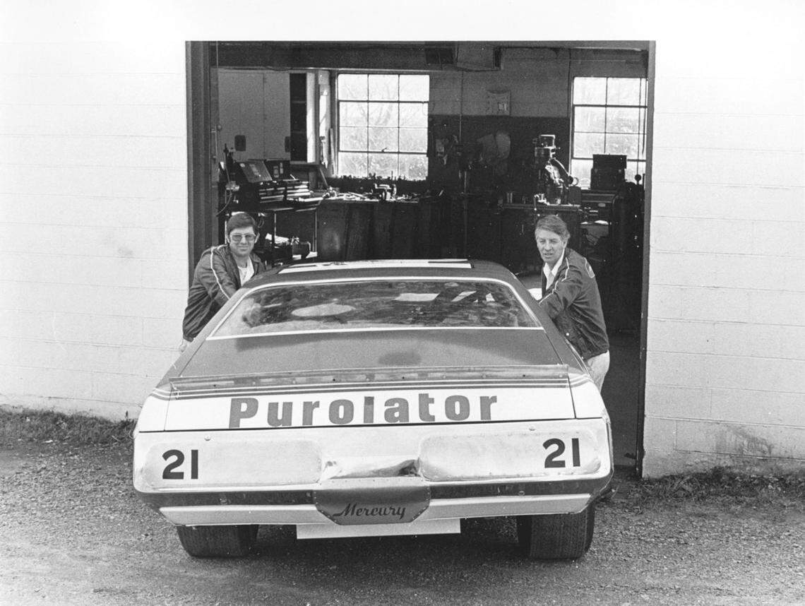 STUART, VA - 1974: The Wood Brothers team (Leonard on left with brother Glen) rolls out a new Purolator Mercury from their shop.