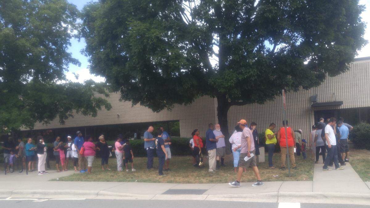 Customers of a Hardees on Little Rock Road, where a worker was found in June to be infected with Hepatitis A, line up at the health department office on Beatties Ford Road for vaccinations. A new class-action lawsuit accuses restaurant owners of negligence in putting some 4,000 customers at risk of contracting the disease.