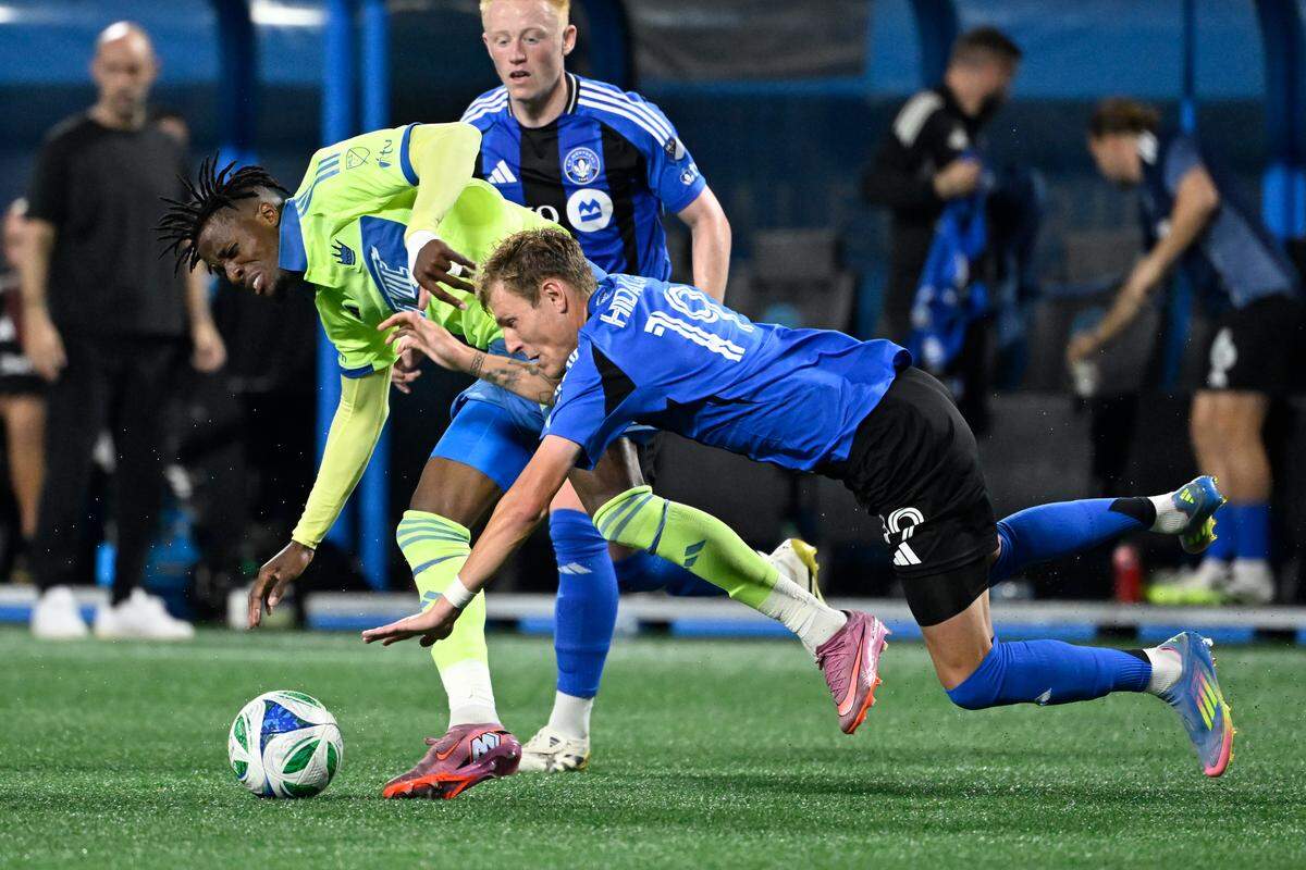 Sep 27, 2025; Charlotte, North Carolina, USA;  Charlotte FC forward Wilfried Zaha (10) is fouled by CF Montréal midfielder Nathan-Dylan Saliba (19) in the second half at Bank of America Stadium. Mandatory Credit: Bob Donnan-Imagn Images