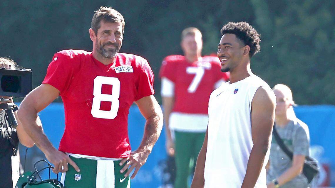 New York Jets quarterback Aaron Rodgers, left and Carolina Panthers quarterback Bryce Young, right, talk prior to the team’s joint practice at Wofford College in Spartanburg, SC on Wednesday, August 9, 2023.