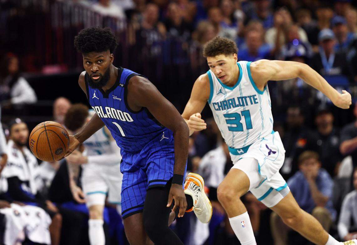 Orlando Magic forward Jonathan Isaac (1) drives to the basket as Charlotte Hornets forward Tidjane Salaun (31) defends during the second half at Kia Center.