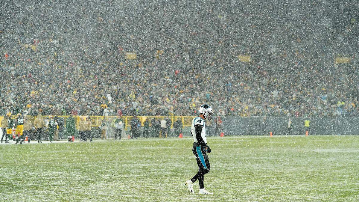 Charlotte Observer photographer Jeff Siner won a top 10 award for sports feature photos for this shot of Panthers quarterback Kyle Allen walking off Lambeau Field in the snow.