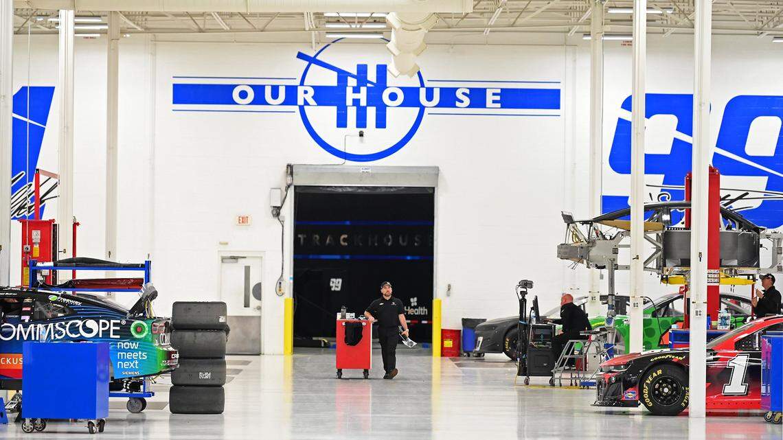 Trackhouse Racing team members work on the team’s cars in Concord.