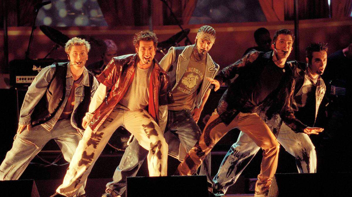 FILE - In this June 3, 2000 file photo, members of NSync, from left, Lance Bass, Joey Fatone, Justin Timberlake,  JC Chasez and Chris Kirkpartrick perform at the 9th annual MTV Movie Awards in Culver City, Calif. The boy band will earn a star on the Hollywood Walk of Fame on April 30.  (AP Photo/Chris Pizzello, File)