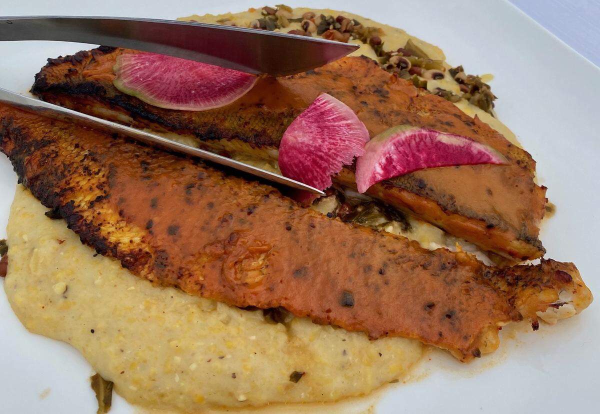 Chef Gregory Collier’s dish for the inaugural Friends of James Beard Benefits Stadium Chef Series was grilled Lake Michigan Walleye with sweet potato, west Carolina BBQ sauce, 18th century roasted grits and fermented collard green slaw.