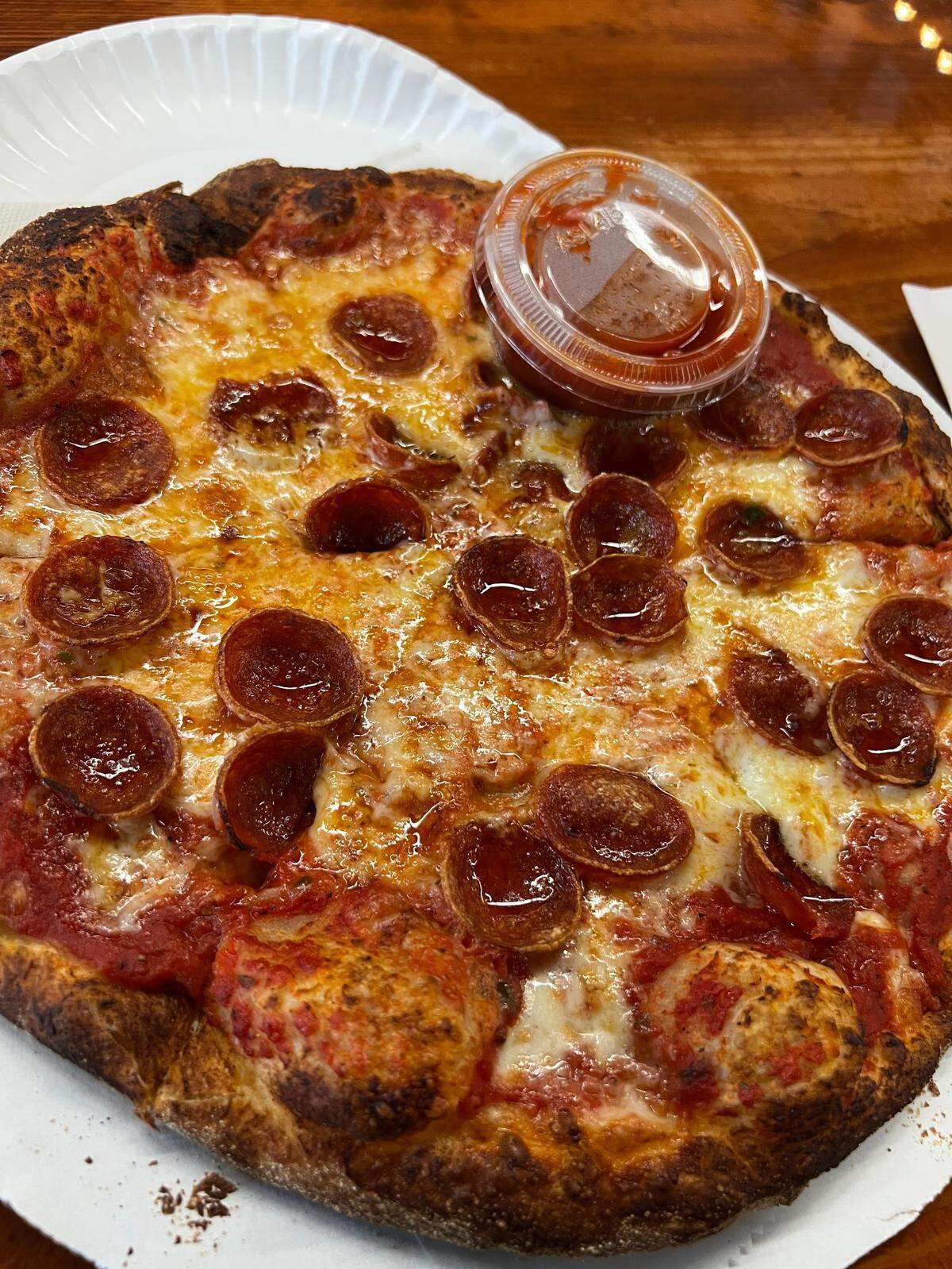 Geno D’s Pizza pies are thin crust, without being a cracker, crispy, without being rock hard, and tangy, without being overly acidic. 