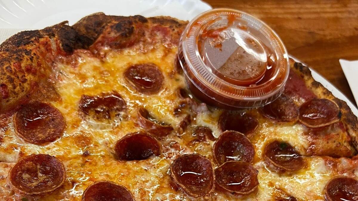 Geno D’s Pizza pies are thin crust, without being a cracker, crispy, without being rock hard, and tangy, without being overly acidic.
