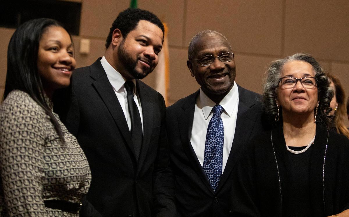 At-Large Commissioner Arthur Griffin Jr. stands with his family at the Charlotte-Mecklenburg Government Center Monday, Dec. 5 in Charlotte, NC.