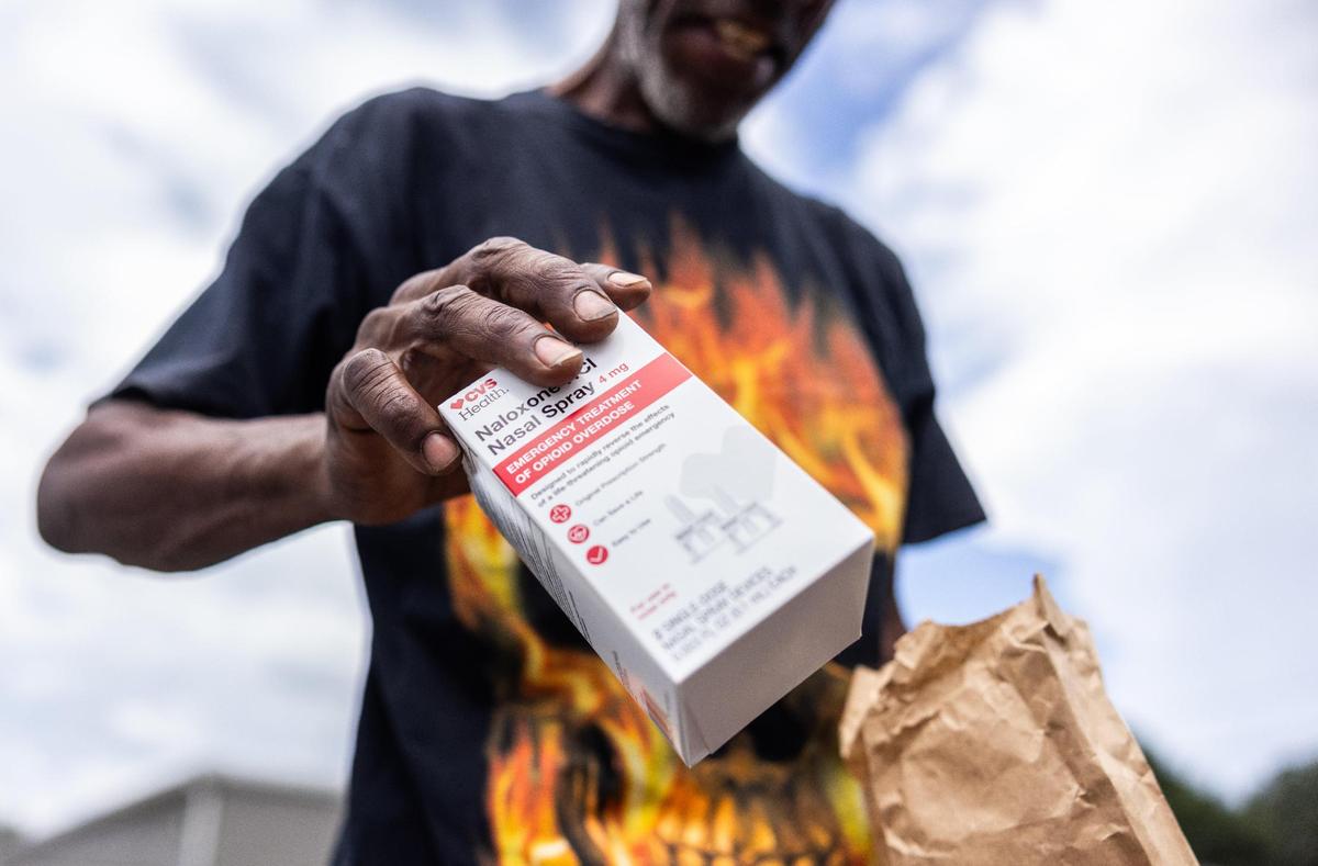 James Patton shows a box of Narcan given to him at Hajee House Harm Reduction in Charlotte on Thursday, July 17, 2025.