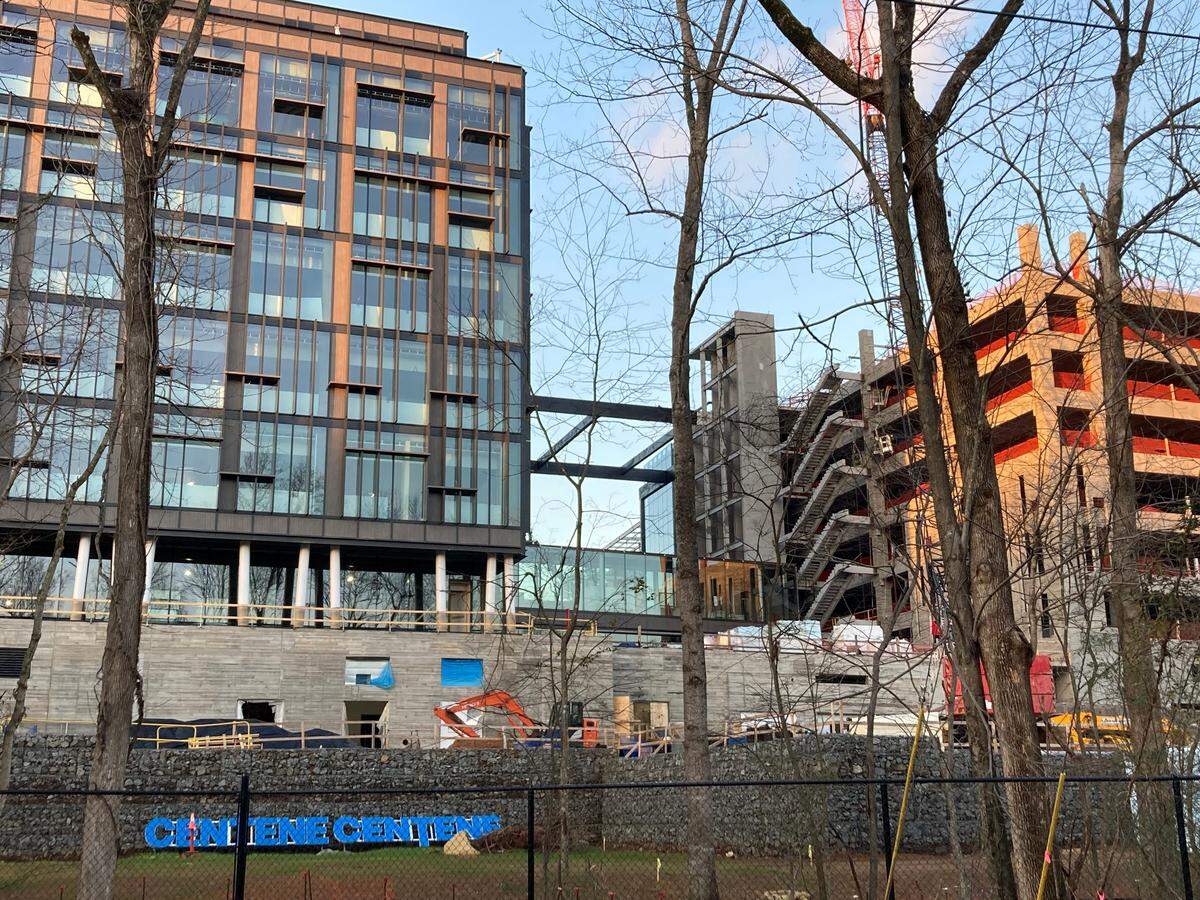A photo from February shows the Centene office building under construction from the Mallard Creek Greenway. The company name’s letters are on the ground.