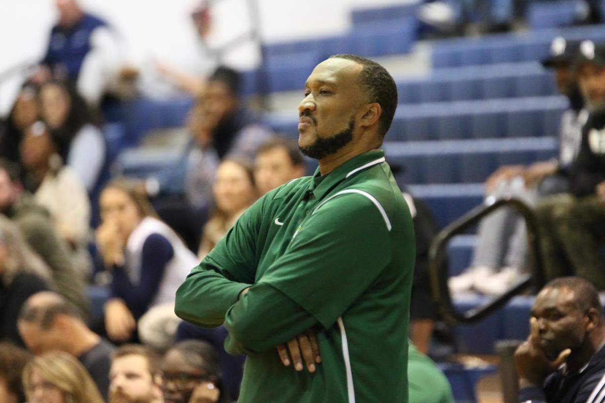 Independence High boys’ basketball coach Preston Davis seems pleased with team’s play during Tuesday’s game at Hickory Ridge on November 18, 2025