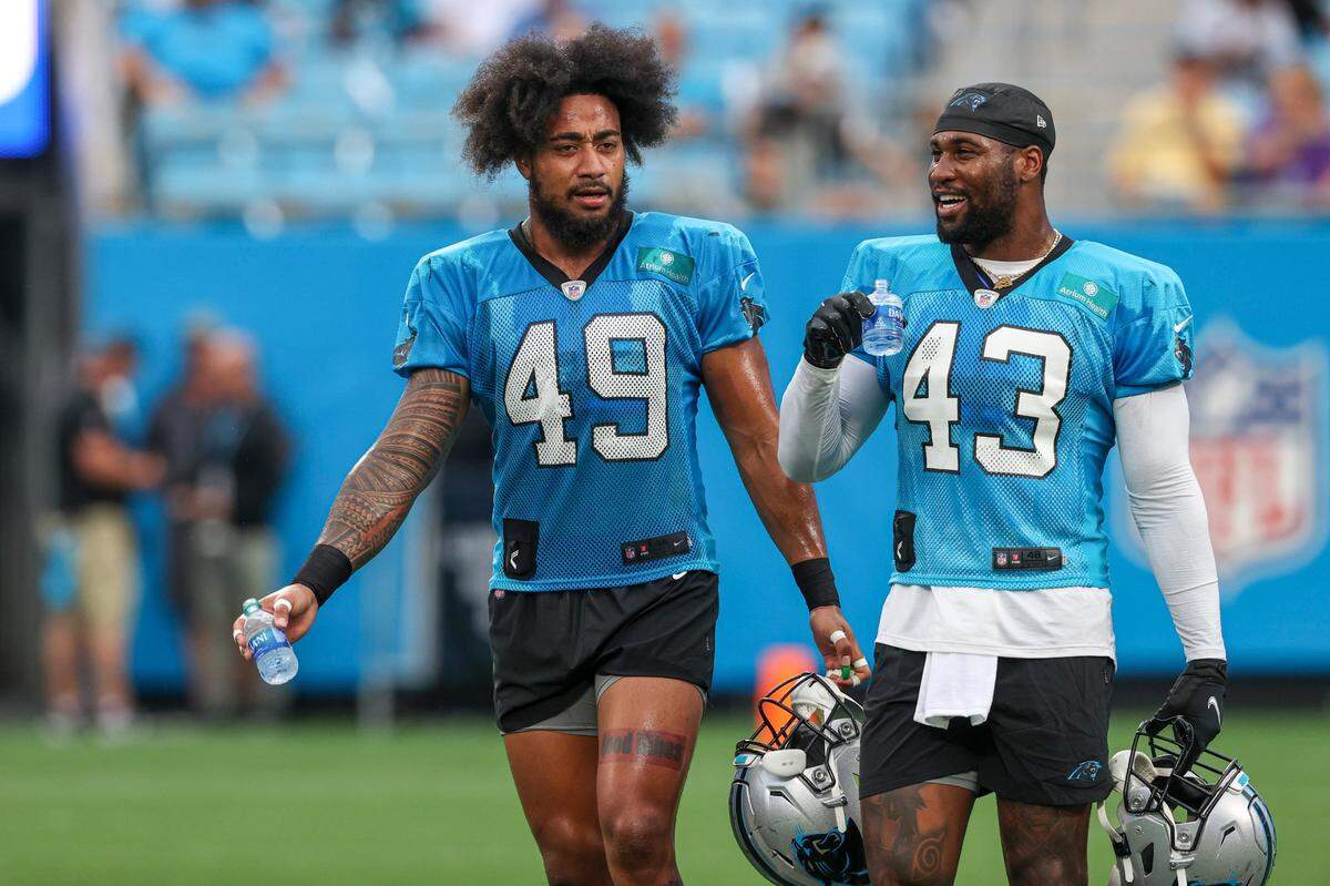 Carolina Panthers linebackers Frankie Luvu (49) and Haason Reddick (43) talk during the NFL football team’s Fan Fest practice in Charlotte, N.C., Friday, Aug. 6, 2021.